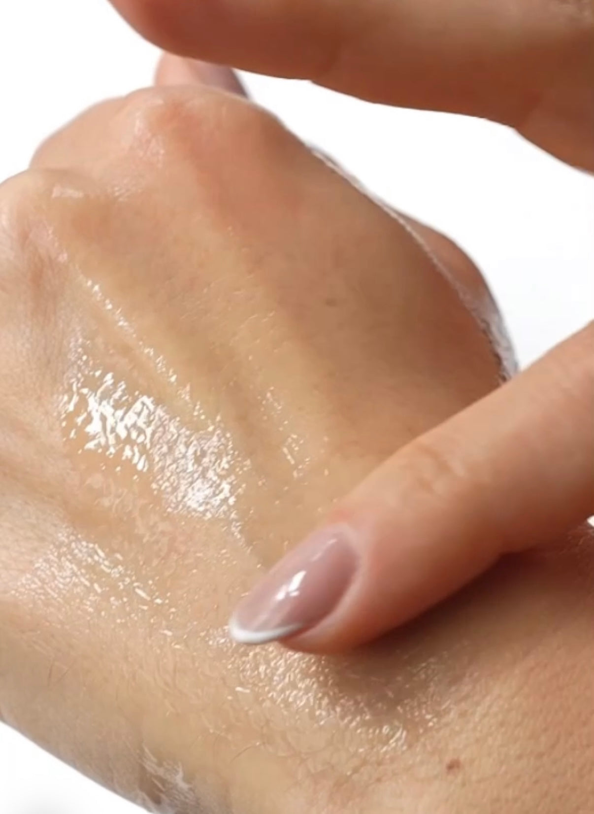 Close-up of Anara Rejuvenating Eye & Face Serum on the hand