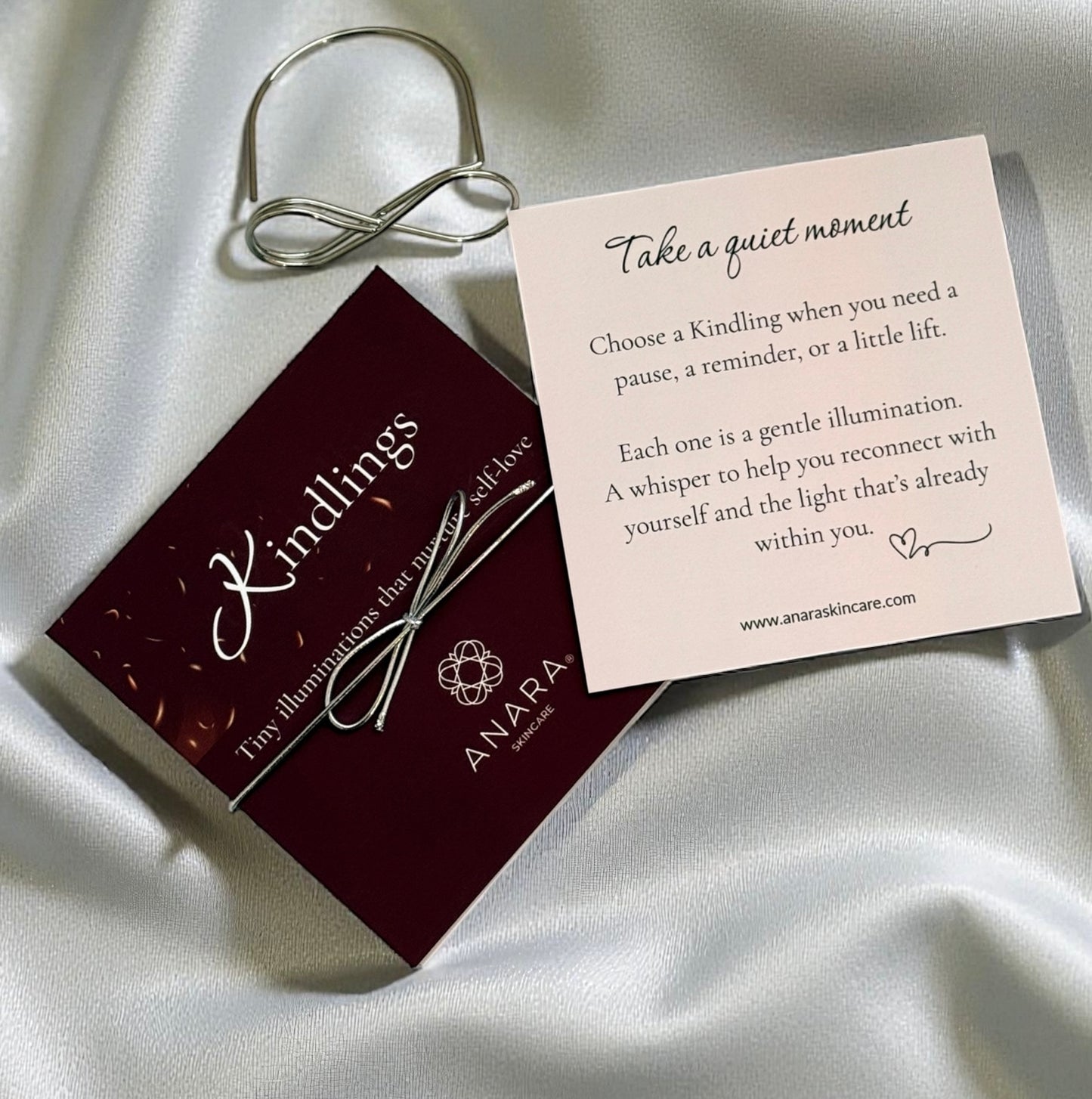 
                  
                    Anara Kindlings set and the intro card with the metal infinity holder
                  
                