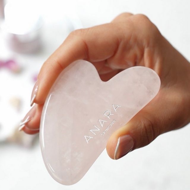 Anara Skincare Rose Quartz Gua Sha being held