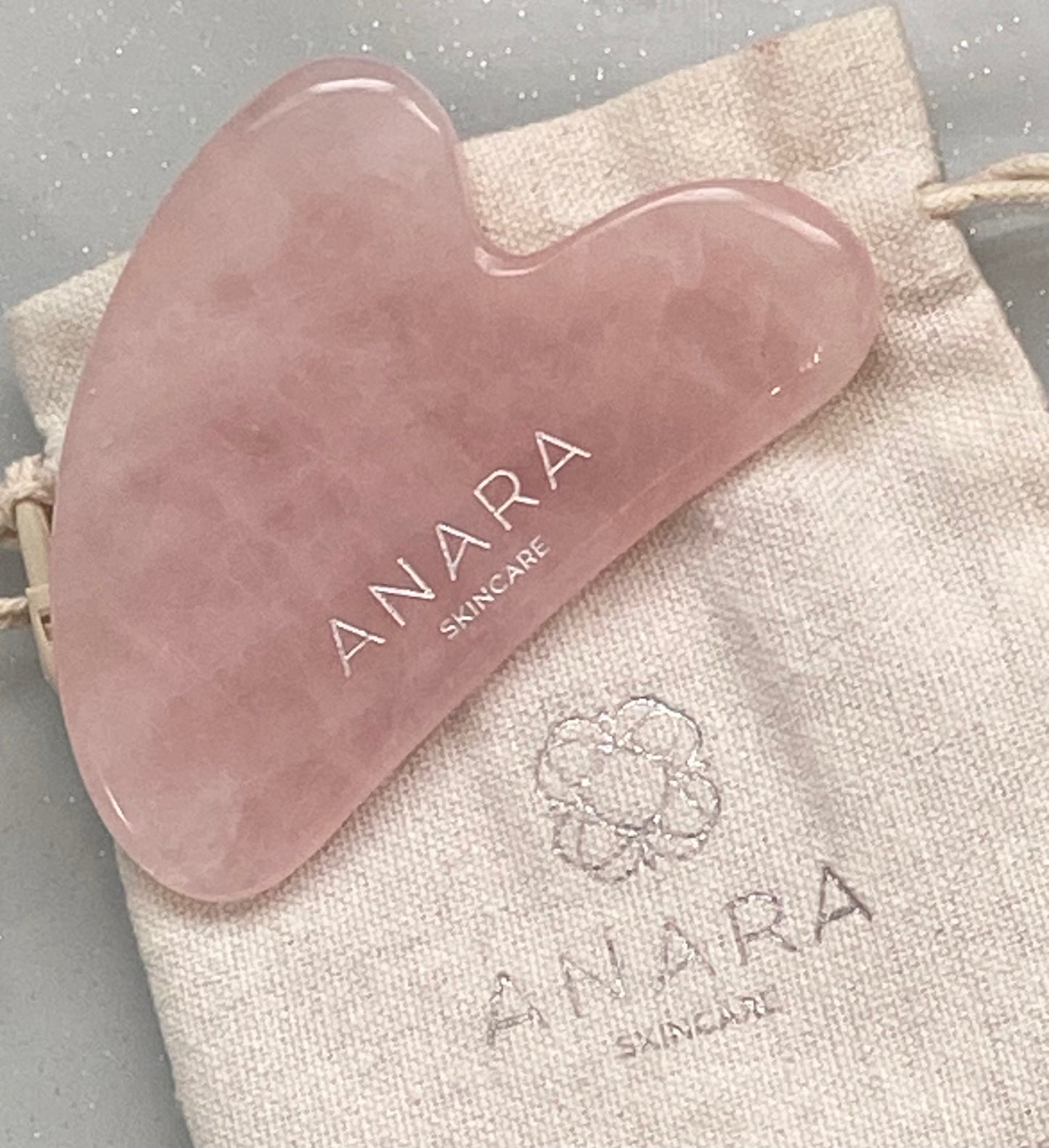 
                  
                    Anara Skincare Rose Quartz Gua Sha with brand cotton pouch
                  
                