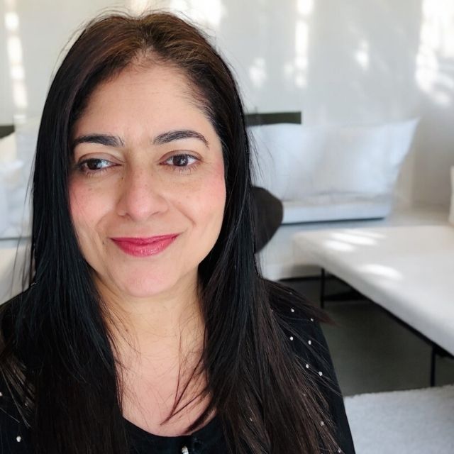 Arati, Founder of Anara in a light-filled living room