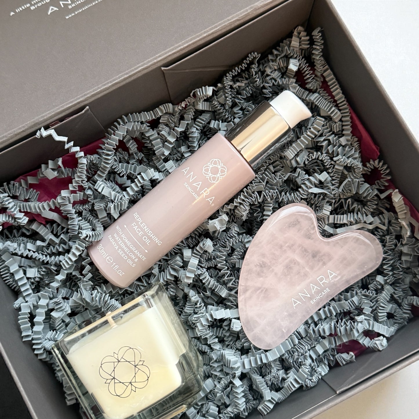 Anara Your Moment Candle, Replenishing Face Oil and Rose Quartz Gua Sha in gift box