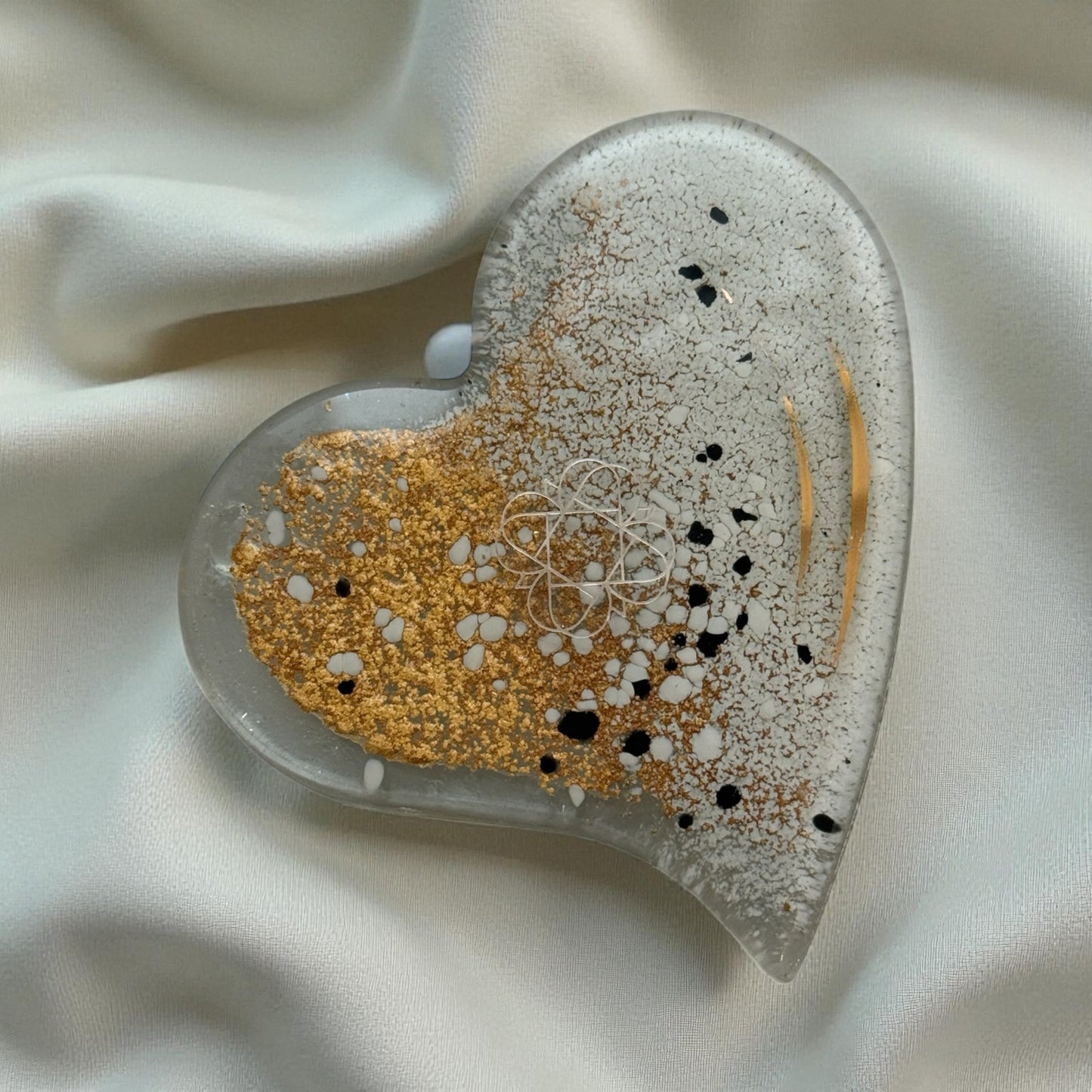 
                  
                    Heart shape Eratini fused glass candle plate on cream fabric
                  
                