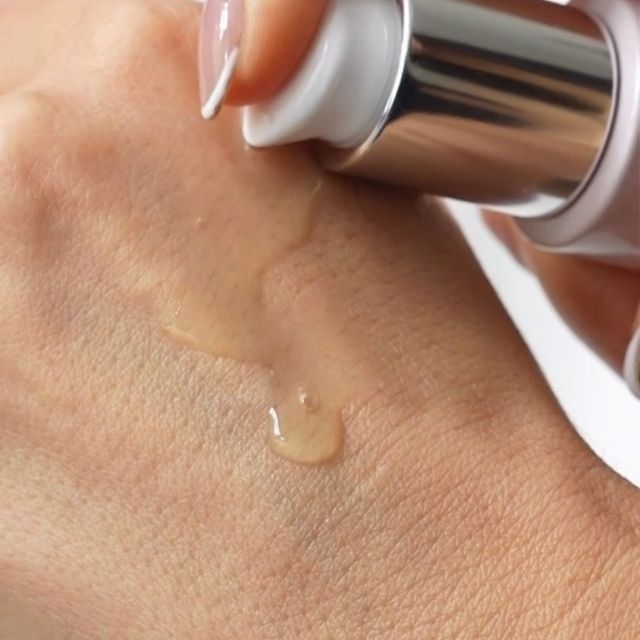 Anara Skincare Hydrating beauty Essence being dispensed on back of hand