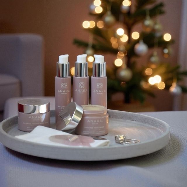 Anara products on a tray with a blurred Christmas tree in the background