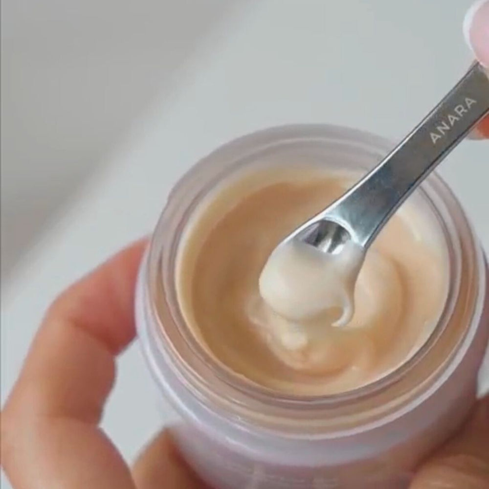 
                  
                    Jar of Anara Skincare Radiance Moisturiser with a spoon lifting some out, brand 'ANARA' visible
                  
                