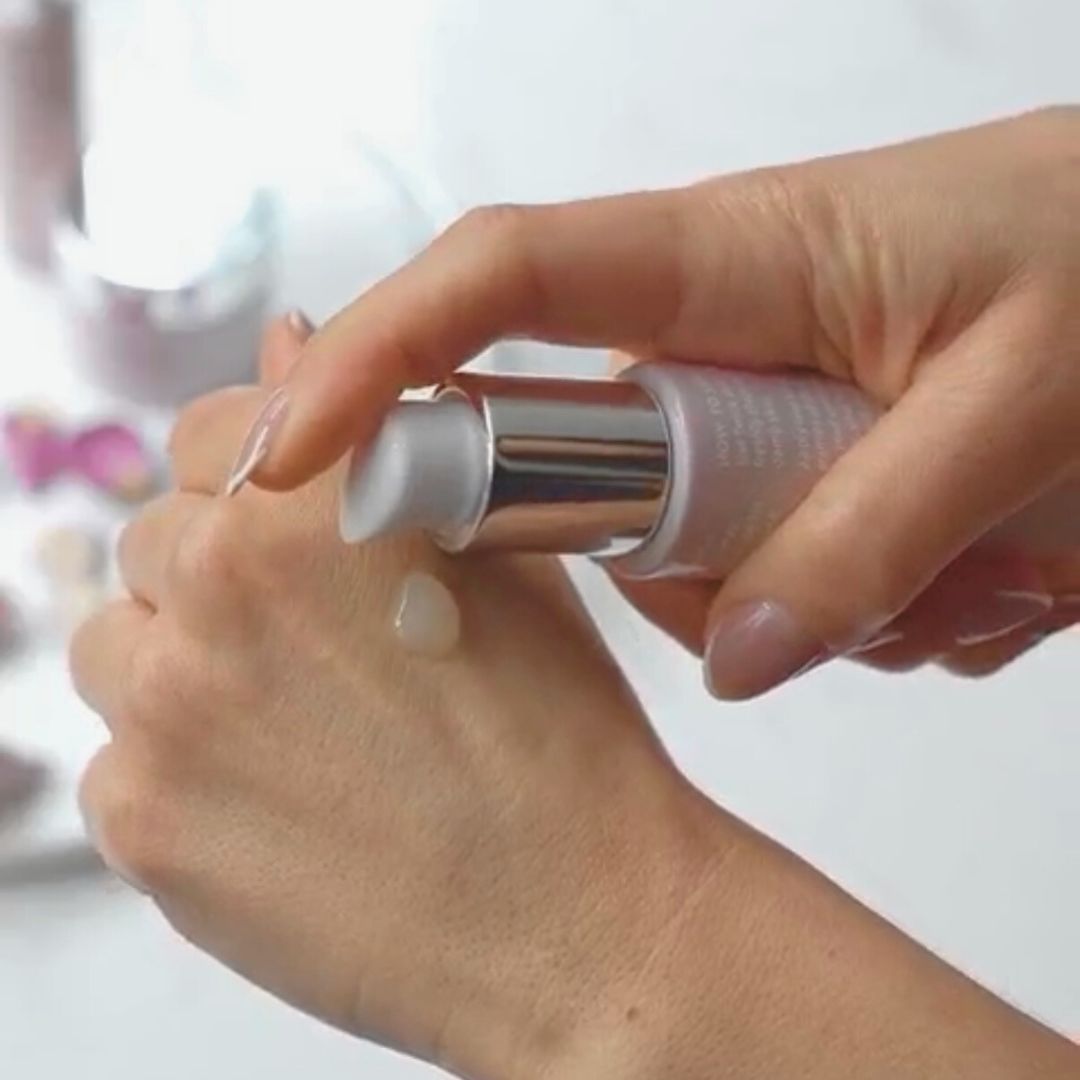
                  
                    Anara Skincare Rejuvenating Eye & Face Serum being dispensed onto the back of the hand with blurred background
                  
                