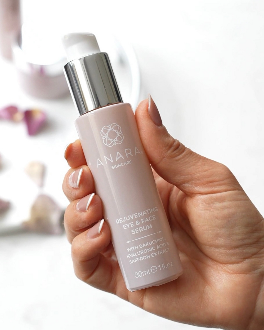 Anara Skincare Rejuvenating Eye & Face Serum in hand