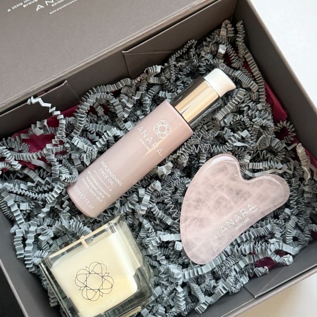 Anara Skincare square candle, Replenishing Face Oil and Rose Quartz Gua Sha inside gift box