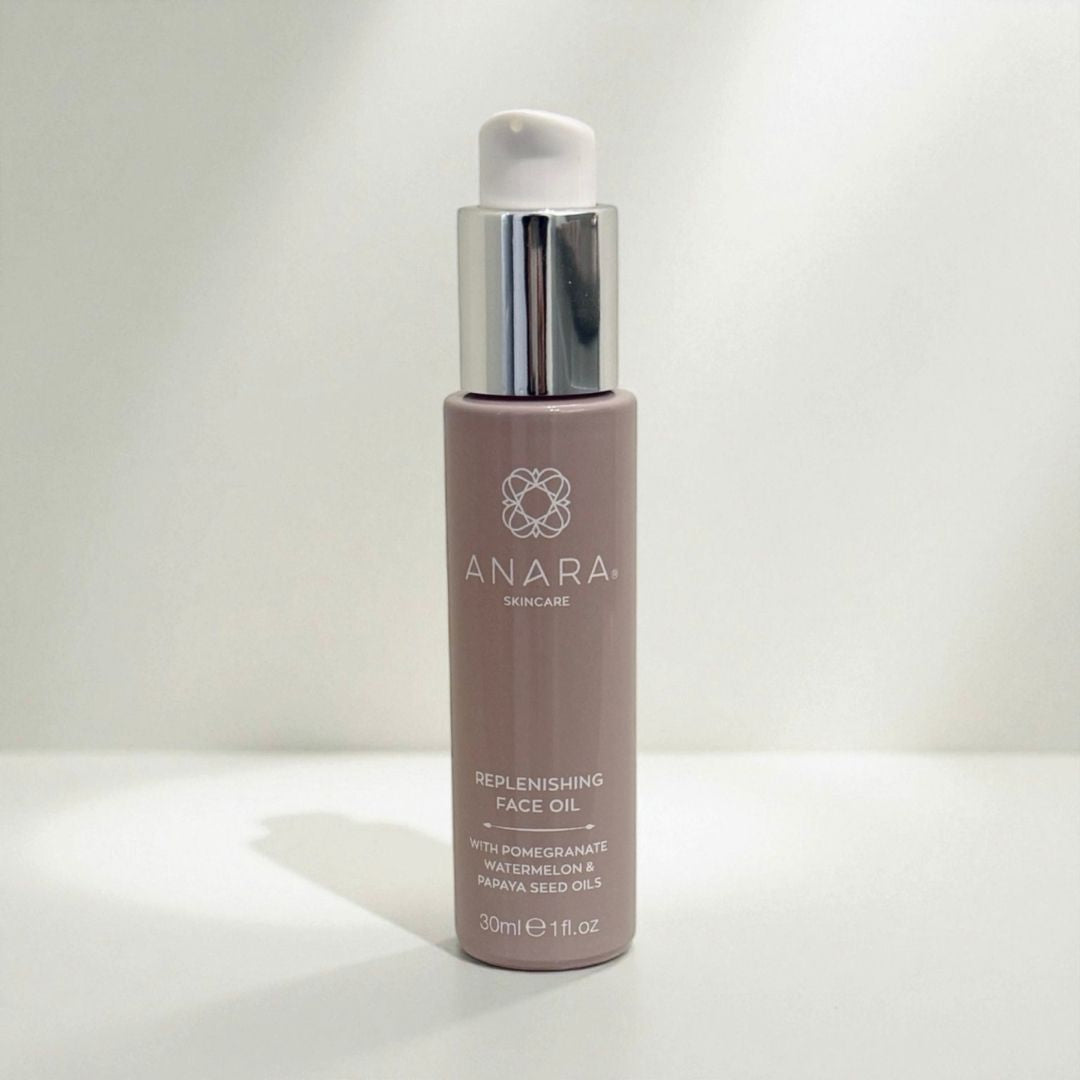 Anara Skincare Replenishing Face Oil bottle on a neutral background with light