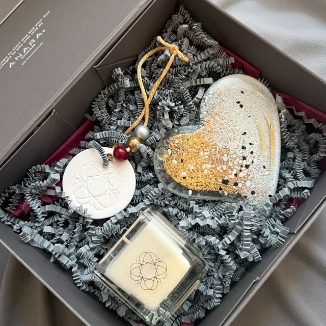 Anara Skincare square candle, heart shape Eratini fused glass plate and Anara emblem porcelain scent diffuser in gift box