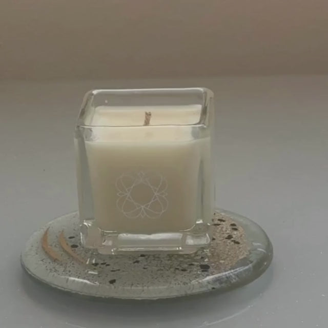 Anara Skincare Natural Aromatherapy square candle on Anara Eratini fused glass plate being lit